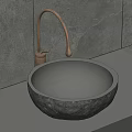 Round Stone Washbasin with Gold Faucet on Gray Wall Background