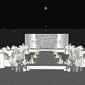 Elegant Banquet Hall With White Floral Decor Wedding Arch Aisle Candles And Chairs