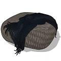 Modern Round Textured Fabric Ottoman With Black Fringed Blanket On Top Surface
