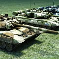 Three Military Tanks On Green Grass Field With Camouflage Patterns