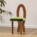 Modern Leisure Chair With Wooden Arch Backrest And Green Velvet Seat On Wooden Floor
