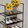Black Multi tiered Shoe Rack with Brown Bag Vase Sunflowers and Various Shoes