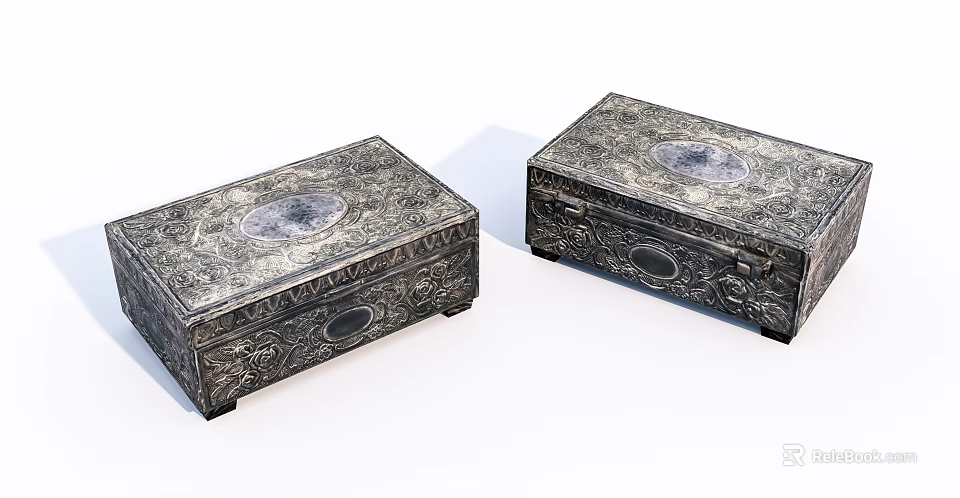 Two Silver Jewelry Boxes With Intricate Carvings And Circular Medallions 3d model 