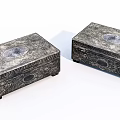 Two Silver Jewelry Boxes With Intricate Carvings And Circular Medallions