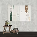 Abstract Textured Canvas Artworks On Neutral Wall With Wooden Stool And Potted Plant