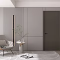 Modern Living Space With Gray Hinged Door Gray Armchair Side Table Plant And Rug