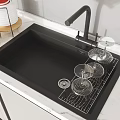 Black Kitchen Sink with Dish Rack and Glass Cups and Black Faucet on Marble Countertop