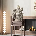 Classic Buddha Sculpture On Wooden Stand With Fireplace And Green Plants Decor