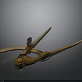 Vintage Ornate Metal Tool Featuring Golden Decoration And Intricate Carved Patterns