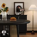 Modern Black Round Dining Table And Chairs With Beige Seat Cushions Sunflowers Bread Green Apples