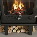 Black Wood Burning Fireplace With Flames Stacked Firewood Logs And Fireplace Tools