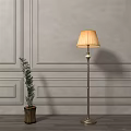 Stylish Floor Lamp With Lampshade And Metal Stand By Gray Paneled Wall With Potted Plant
