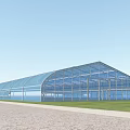 Modern Glass Building With Curved Roof In Green Grass And Paved Ground Area