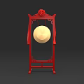 Traditional Musical Instrument Gong on Red Ornate Stand with Decorative Flower