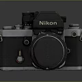 Vintage Nikon SLR Camera With Classic Black Silver Body And Lens Cap