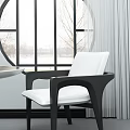 Modern Armchair With Black Frame And White Cushion In Bright Interior Near Window
