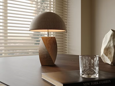 Illuminated Table Lamp With Geometric Wooden Base Fabric Shade On Dark Wooden Table With Book 3d model