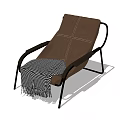Modern Brown Leather Lounge Chair With Black Metal Frame And Checkered Blanket