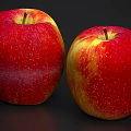Two Fresh Red And Yellow Apples With Spots On Dark Background