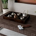 Traditional Tea Set On Wooden Tray With Ceramic Cups And Silver Teapot On Coffee Table