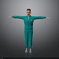 Man In Green Tracksuit Standing With Arms Outstretched On Gray Background