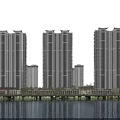 High rise residential buildings at night with exterior lighting and water reflection