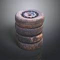 Stack of Used Car Tires with Metal Rims and Worn Tread Surface