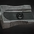 Vintage Metal Pencil Sharpener With Gray Casing Round Knob And Textured Surface