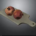 Gray Wooden Cutting Board With Two Fresh Ripe Pomegranates On Top