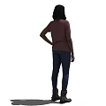 Woman in Pink T-shirt Blue Jeans and Brown Boots Standing with One Hand on Hip