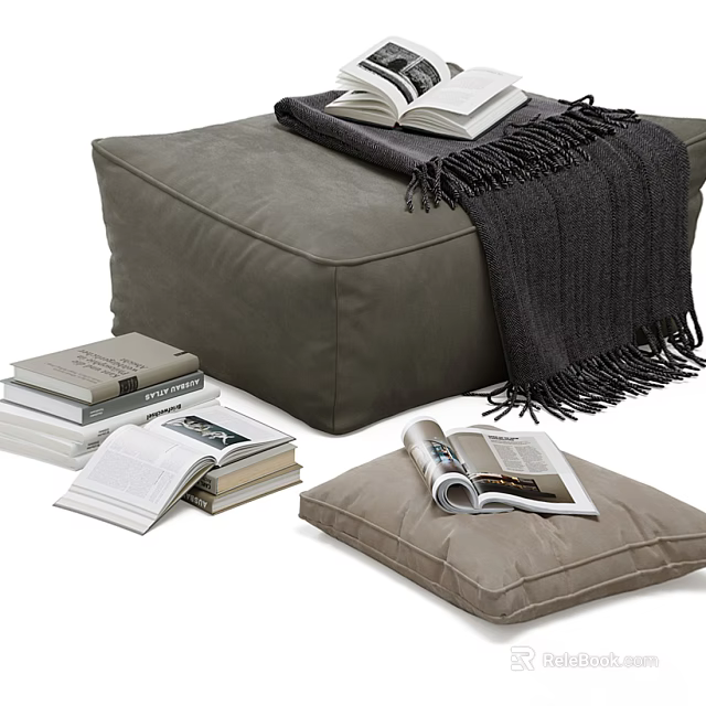 Gray Ottoman With Fringed Blanket Open Book And Light Brown Cushion 3d model 