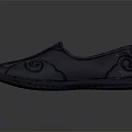 Black Leather Slip On Shoes With Swirl Pattern Stitching And Orange Lining