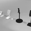 Various Household Items Including Desktop Stands And Small Bases In White Black Green