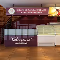 Bright Modern Dessert Shop Interior With Wooden Tables Chairs And Display Cases