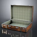 Vintage Leather Suitcase Open With Green Checkered Lining And Metal Fittings On Reflective Surface