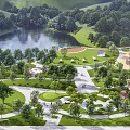 Park Landscape With Lush Trees Serene Lake Green Lawn Winding Paths And Playground Area
