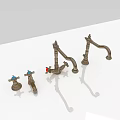 Three Metal Kitchen Faucets with Blue and Red Knobs on White Surface