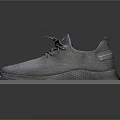 Gray Knit Sneakers With Lace Up Design And Textured Sole On Display Stand