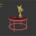 Round Modern Coffee Table With Blue Tabletop Copper Legs And Red Vase With Green Leaves