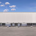 Industrial Warehouse White Exterior With Roll-up Doors Front Parking Lot Vehicles Blue Sky White Clouds