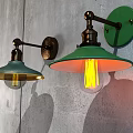 Vintage Industrial Wall Lamps with Green Glass Shades and Brass Arms Mounted on Gray Wall