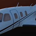 White Passenger Jet Flying In Clear Blue Sky With Sleek Wings And Windows