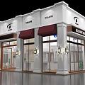 Modern KALATE Storefront With White Building Red Awnings Glass Doors And Windows