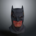 Man Wearing Detailed Batman Mask with Fierce Expression and Dark Design