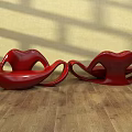 Red Lip Shaped Public Chairs On Wooden Floor With Yellow Wall Light Shadows