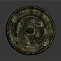 Ancient Circular Bronze Mirror Sculpture With Intricate Patterns And Ornate Details