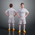 Boys in White Emirates Soccer Jerseys Standing Hands on Hips Back Front View Yellow Cleats
