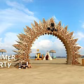 Summer Party Event Entrance Arch With Decorative Wooden Spikes Tents And Umbrellas On Beach