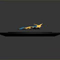 Blue and Yellow Miniature Car Model Displayed on Black Circular Platform