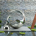 Modern Courtyard Garden Featuring Metallic Sculpture Stone Wall Green Plants And Lotus Leaves On Water